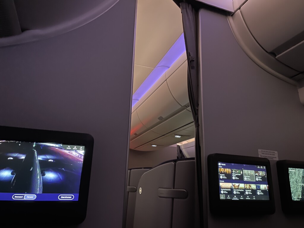 a tv and screen in an airplane