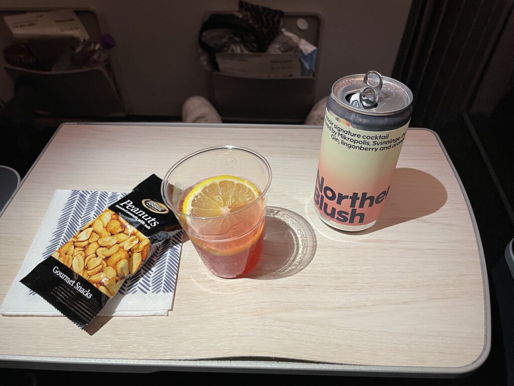 a drink and a can of chips on a table