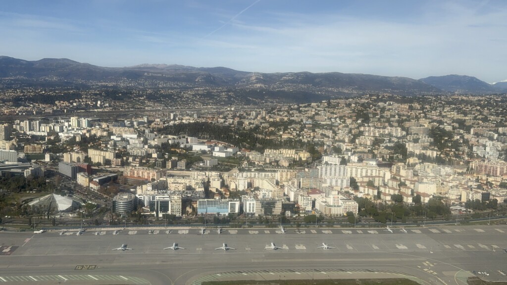 an aerial view of a city with many airplanes