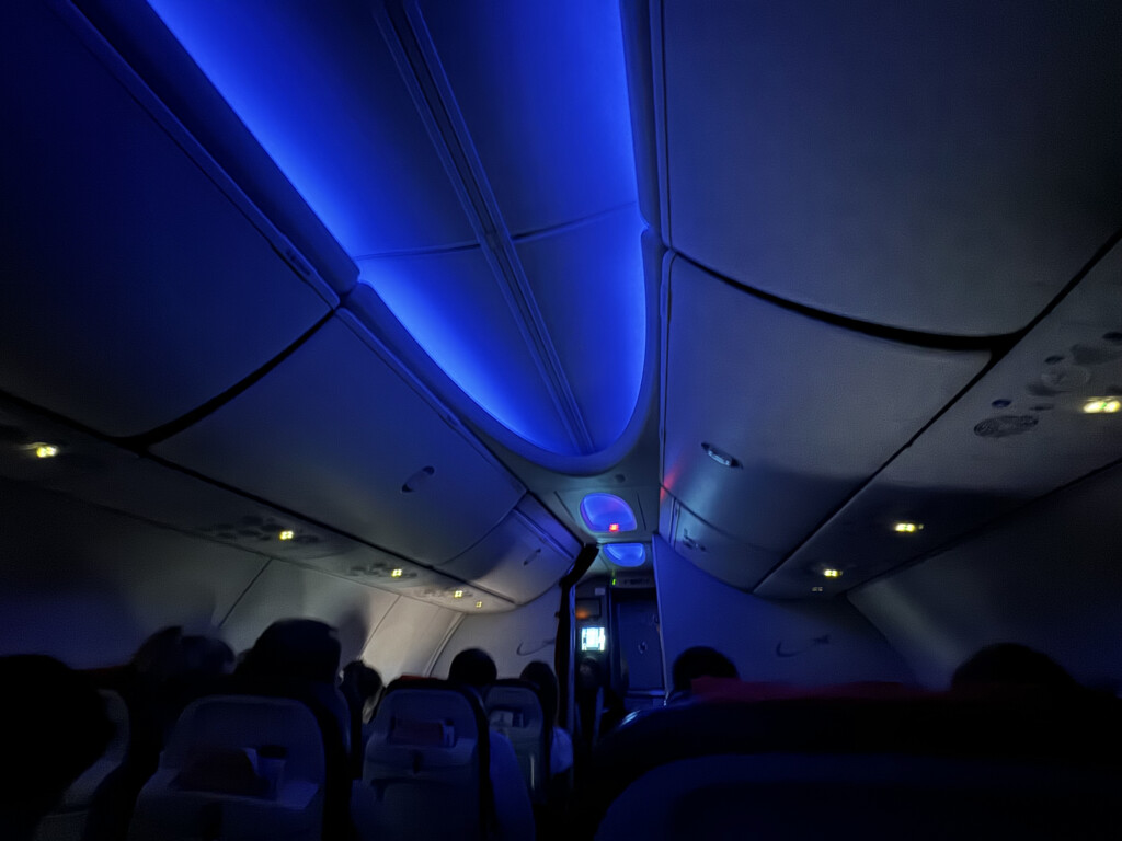 inside an airplane with blue lights