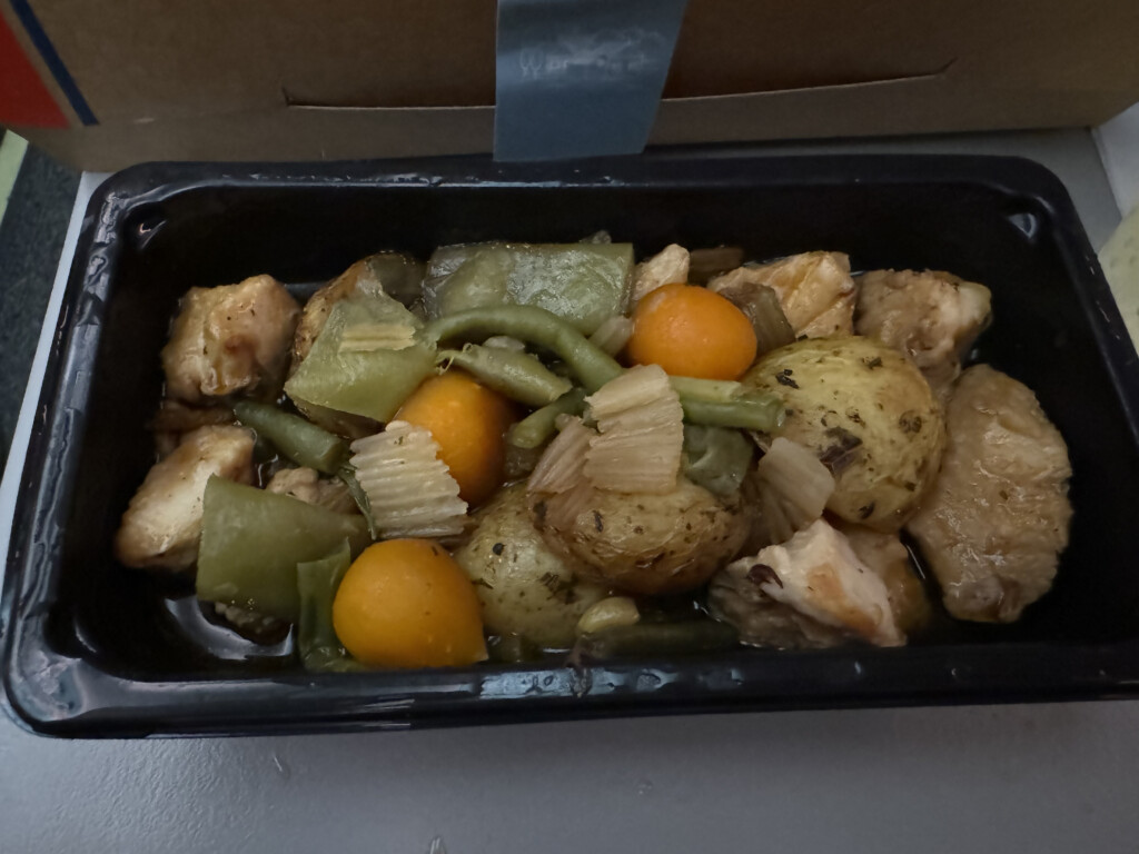 a black container with food in it