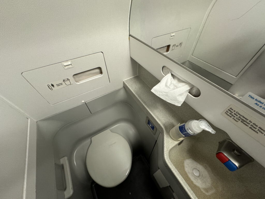 a toilet and sink in a plane