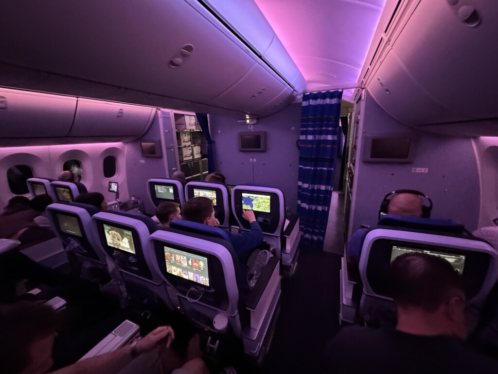 a group of people sitting in an airplane