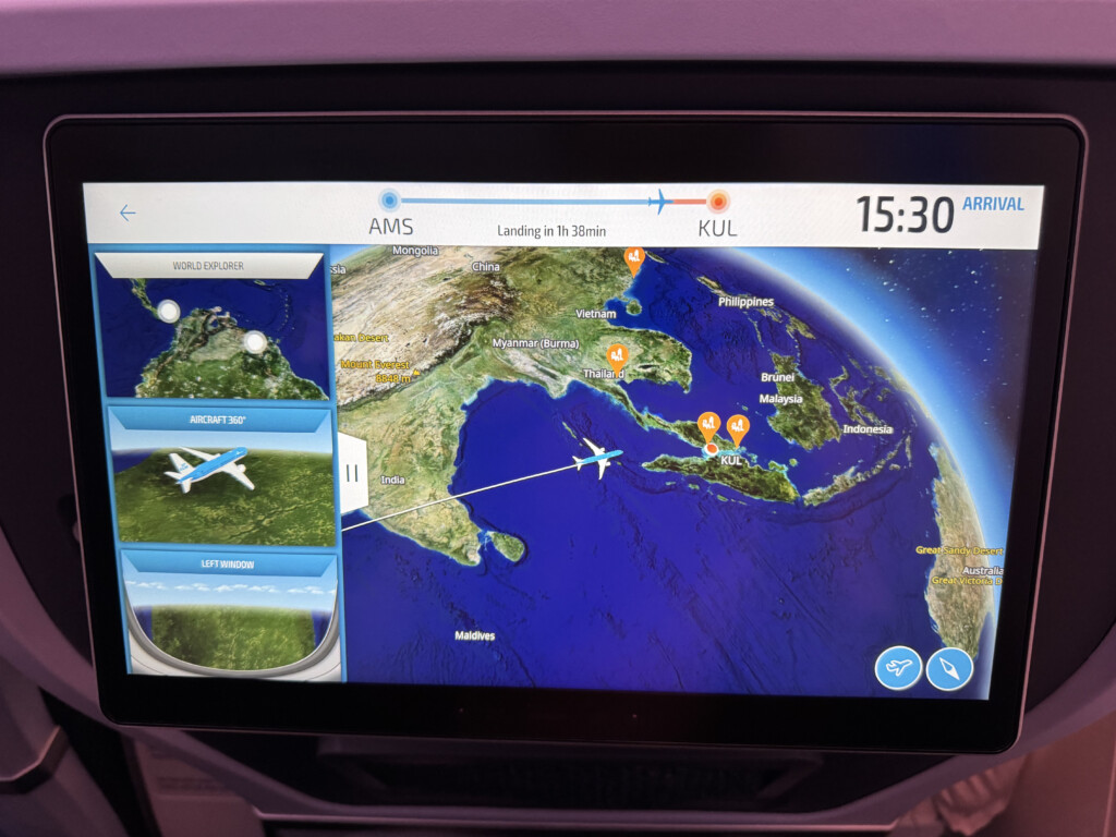 a screen with a map and a plane on it