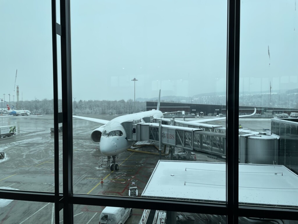 an airplane on a tarmac at an airport