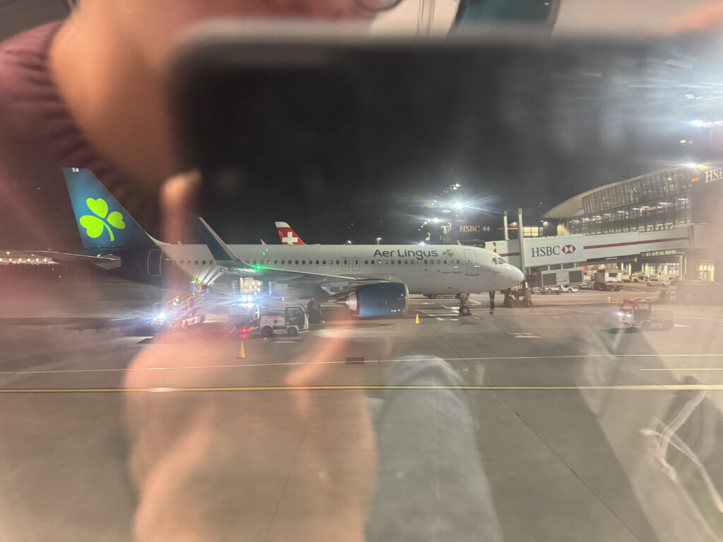a person taking a picture of an airplane