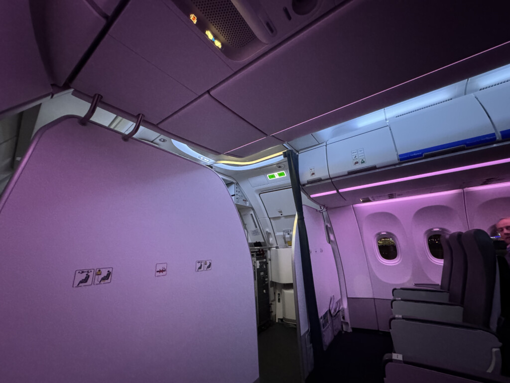 an airplane with purple lights